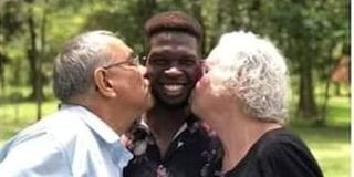 Edwin Chiloba with his adoptive parents 