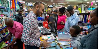 Parents and guardians buy books for their children at Savani’s Book Centre Limited in Nairobi