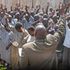 A religious leader conducts a service for inmates at Kodiaga prison in Kisumu County