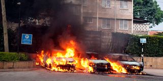 Vehicles in flames at the scene of the terror attack at Dusit D2 Hotel on January 15, 2019.