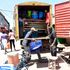 A Vehicle is loaded with household items in Kibera