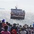 Commuters wait for the arrival of the Mfangano-Mbita ferry in Mbita town