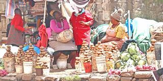 Traders sell potatoes at Muthurwa market in Nairobi