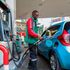 Customer attendant serving a client at Rubis Petroleum Station on Koinange Street, Nairobi