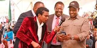 President William Ruto (right) and Prime Cabinet Secretary Musalia Mudavadi (centre) during the launch of the Hustler Fund 