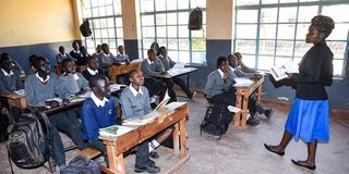 Ms Pauline Bwire teaches Junior Secondary School students at Kapsoya Primary School in Eldoret town