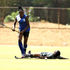 Grace Bwire (down) of Strathmore University Scorpions in action against Alice Owiti  of Lakers