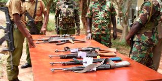 AK-47 guns on a table