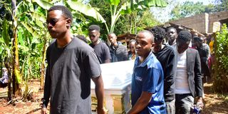 Pallbearers carry to the grave the remains of Regina Wairimu, 22