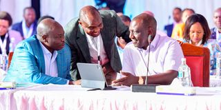 President William Ruto chats with Deputy President Rigathi Gachagua and Head of Public Service Felix Koskei