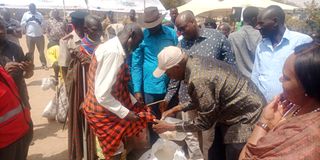 Education Cabinet Secretary Ezekiel Machogu distributing relief food in Turkana on March 7, 2023