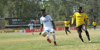 Bandari midfielder James Kinyanjui (left) vies with Tusker defender Daniel Sakari 