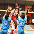 David Neeke (left) and Eugene Okello of Trailblazers block an attack from Timon Kimutai of Kenya Prisons