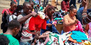 Customers check out second-hand clothes in Gikomba market, Nairobi
