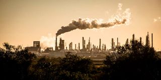 Smoke cloud rises from an oil petroleum refinery