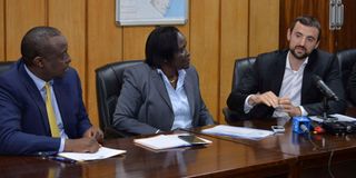 Helios Investment principal partner Pierre Heinrich (right) speaks during the acquisition deal signing of the sale of shares