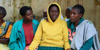 Ms Everline Miruka (centre) is consoled by relatives at the Coptic Hospital mortuary in Maseno, Kisumu County