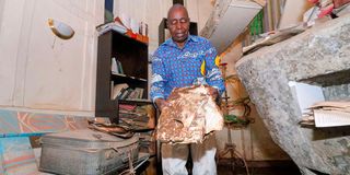 Reverend Timothy Njoya at his library at Karinyo Rock Gardens in Zambia Estate, Ngong