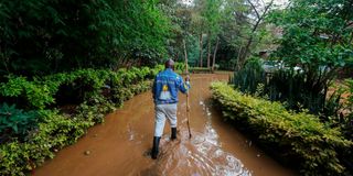 Reverend Timothy Njoya at his flooded compound in Ngong