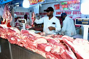 An attendant at Zad’s Butchery and Meat Suppliers stocks up fresh meat at Burma Market in Nairobi