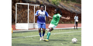 Elizabeh Mutikiza (left) of Gaspo Women dribbles past Alice Nyaboke of Kangemi Ladies