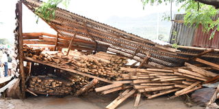 A timbre store that was brought down by heavy rains and floods at Ortum market