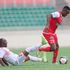 Ulinzi Stars defender Njoroge Wilfred (left) vies for the ball with Kenya Police midfielder Clifton Miheso 