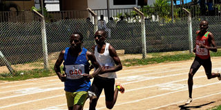 Alfred Kipketer (left) leads the men's 800 metres race