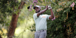 Dennis Maara follows the progress of his tee shot