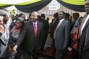 Former Prime Minister Raila Odinga (right) and former IEBC chairman Issack Hassan in Kibera 