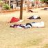 City residents take a nap at Jeevanjee Gardens in Nairobi