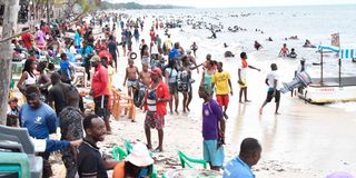 Holidaygoers relax at the Jomo Kenyatta Public Beach in Mombasa