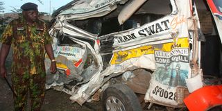 Newly posted Naivasha sub-county police commander Benjamin Boen inspects the matatu that collided with a trailer at Delamare