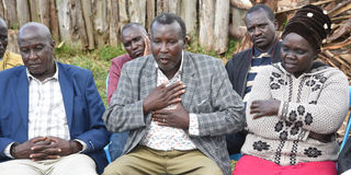 Mr Jonathan Kosgei (centre) with his wife Leah Kosgei, parents of the late Rodgers Kipruto, 28