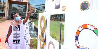 Ushanga CEO Dorothy Mashipei showing samples of beadwork at the Kenya National Library Services, Nairobi