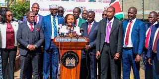 Council of Governors chairperson Anne Waiguru (centre) with her colleagues during a media briefing in Nairobi