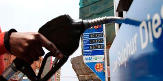 An attendant at a Nyeri petrol station prepares to fill up a car in August 2020.