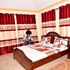 Airbnb Vacation Rentals owner Corazon Chepkemboi prepares a bed for guests at the facility that is located on Beach Road