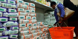 Customers shop for subsidized maize flour at the Naivas Supermarket.