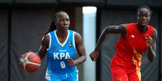 KPA's Natalie Akinyi (left) vies for the ball with Margaret Ayieko of Strathmore University Swords