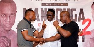 Kenyan boxer Daniel Wanyonyi (left) faces off with his Tanzanian opponent Karim "Mtu Kazi" Madonga