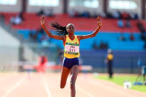 Winny Boinnett crosses the finish line to win the women's 3,000 metres steeplechase race