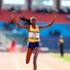 Winny Boinnett crosses the finish line to win the women's 3,000 metres steeplechase race