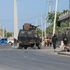 Security forces patrol outside a building which was attacked by suspected Al-Shabaab militants in Mogadishu 
