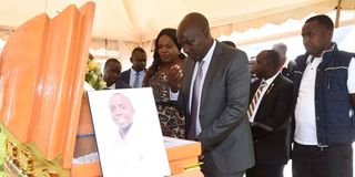 Uasin Gishu Deputy Governor John Barorot pays his last respects to the late Rodgers Kipruto who died by suicide in Finland