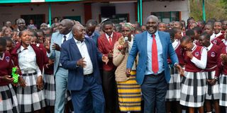Former Kericho Senator Andrew Langat (in red tie) and other residents of Keringet celebrate