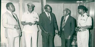 Then President Daniel Arap Moi and Director of Intelligence Mr James Kanyotu