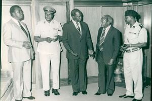 Then President Daniel Arap Moi and Director of Intelligence Mr James Kanyotu