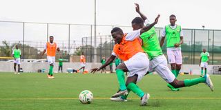 Boniface Omondi (left) vies for the ball with Luke Otiala