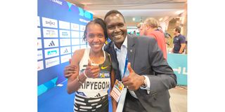 Kenya's Faith Kipyegon poses for a photo with National Olympic Committtee of Kenya (NOC-K) President Paul Tergat 